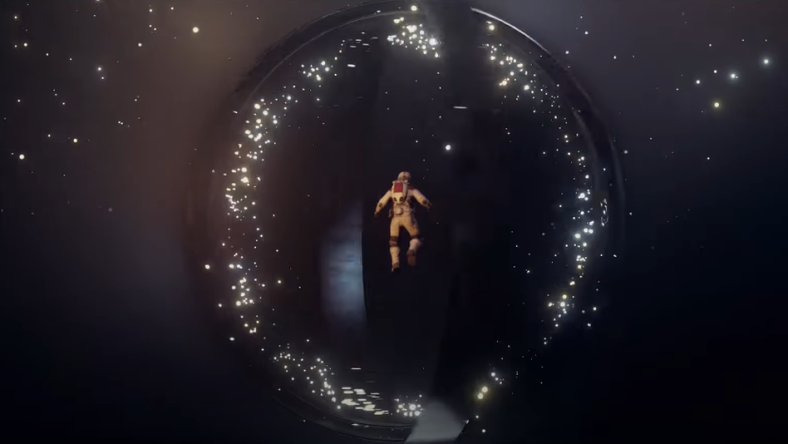 An astronaut floats before a whirling alien artifact made of rings via Starfield: Official Launch Date Announcement, Bethesda Softworks YouTube