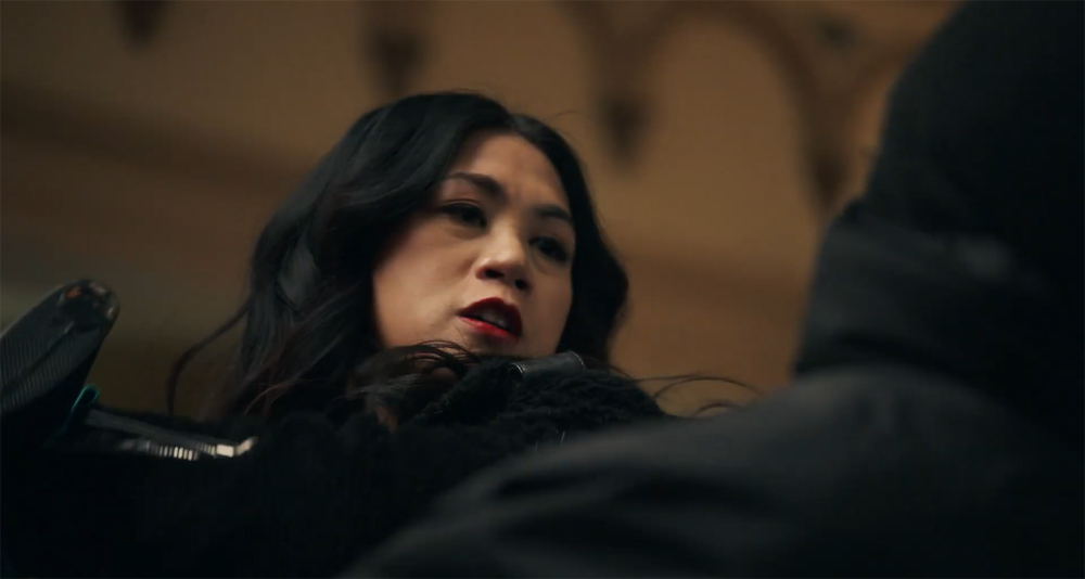 Actress Liza Lapira as 'Mel' delivers a buttstroke to the head of a white man in the CBS television series 'The Equalizer.'