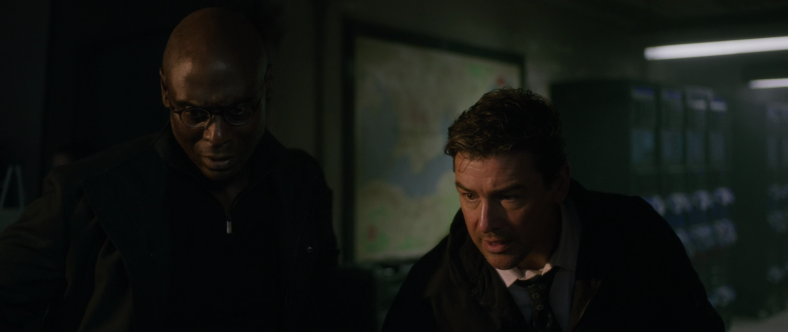 General Guillermin (Lance Reddick) and Dr. Mark Russell (Kyle Chandler) watch on as Mecha Godzilla unleashes its might in Godzilla vs Kong (2021), Warner Bros. Pictures