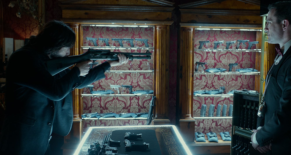 John examines a Berelli shotgun in 'John Wick: Chapter 2' (2017), Lionsgate