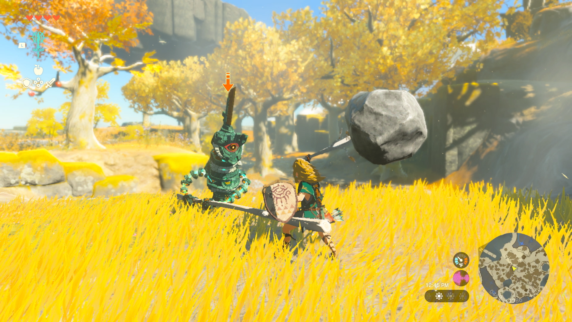 Link fights a construct using a boulder fused to a tree branch via The Legend of Zelda: Tears of the Kingdom (2023), Nintendo