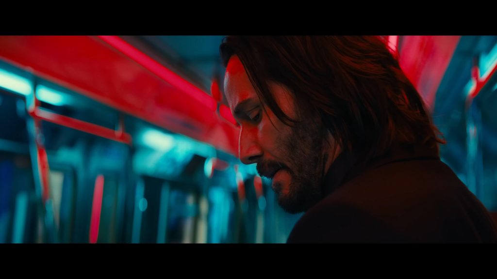 John Wick (Keanu Reeves) takes in his surroundings in John Wick: Chapter 4 (2023), Lionsgate Films