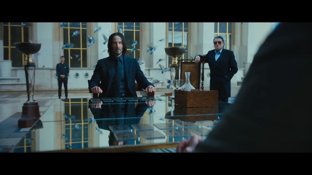 John Wick (Keanu Reeves) meets with Marquis Vincent de Gramont (Bill Skarsgård) in John Wick: Chapter 4 (2023), Lionsgate Films