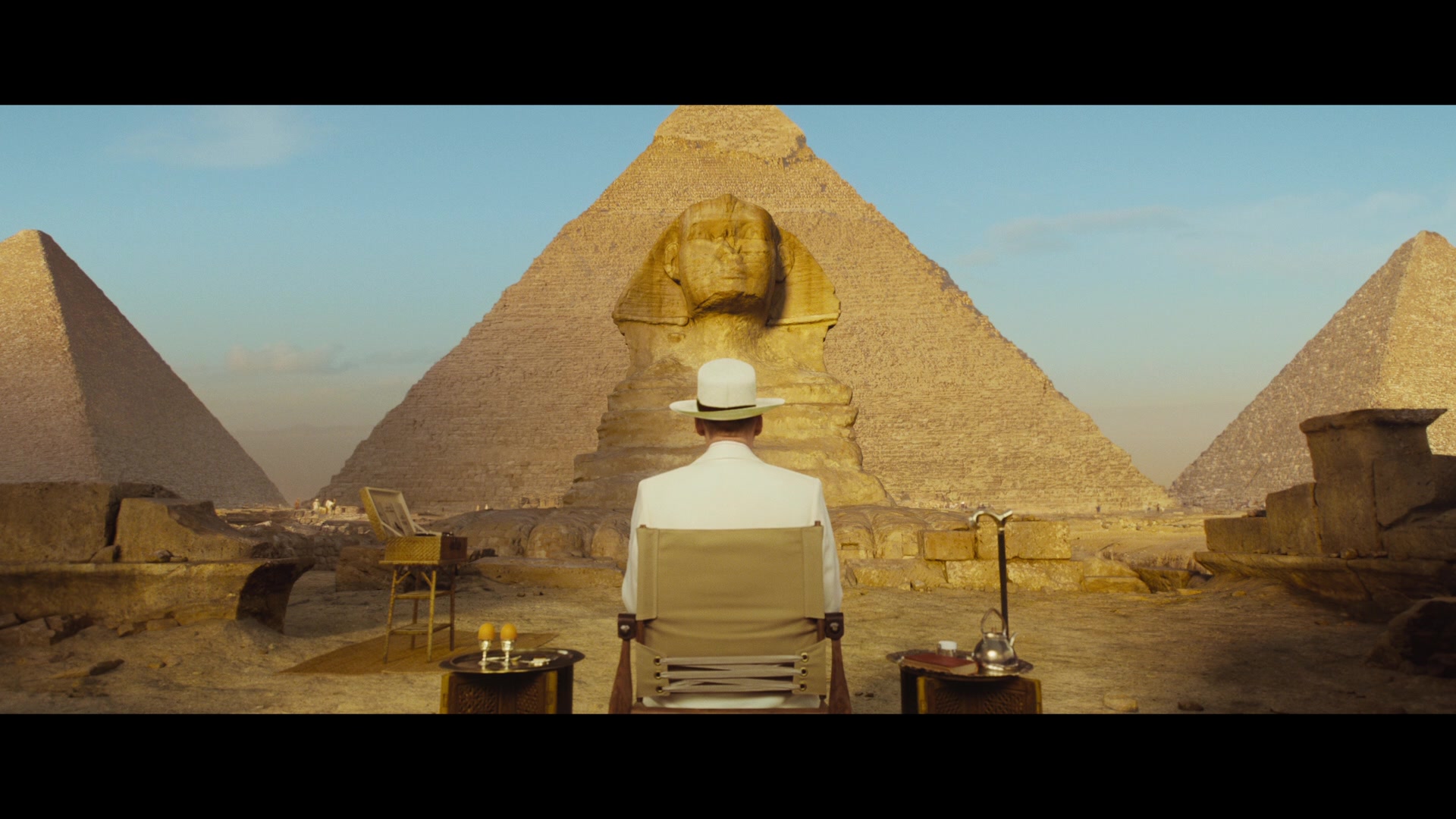 Hercule Poirot (Kenneth Branagh) enjoys breakfast while taking in the sights in Death on the Nile (2022), 20th Century Studios 