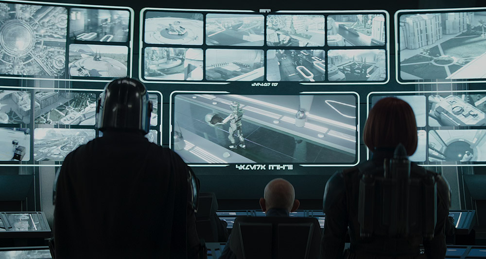 Djarin and Bo-Katan Kryze look at security footage in 'The Mandalorian' (2023), Disney+