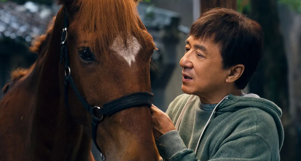 Luo Zhilong (Jackie Chan) and his horse Red Hare in Well Go USA's Ride On.