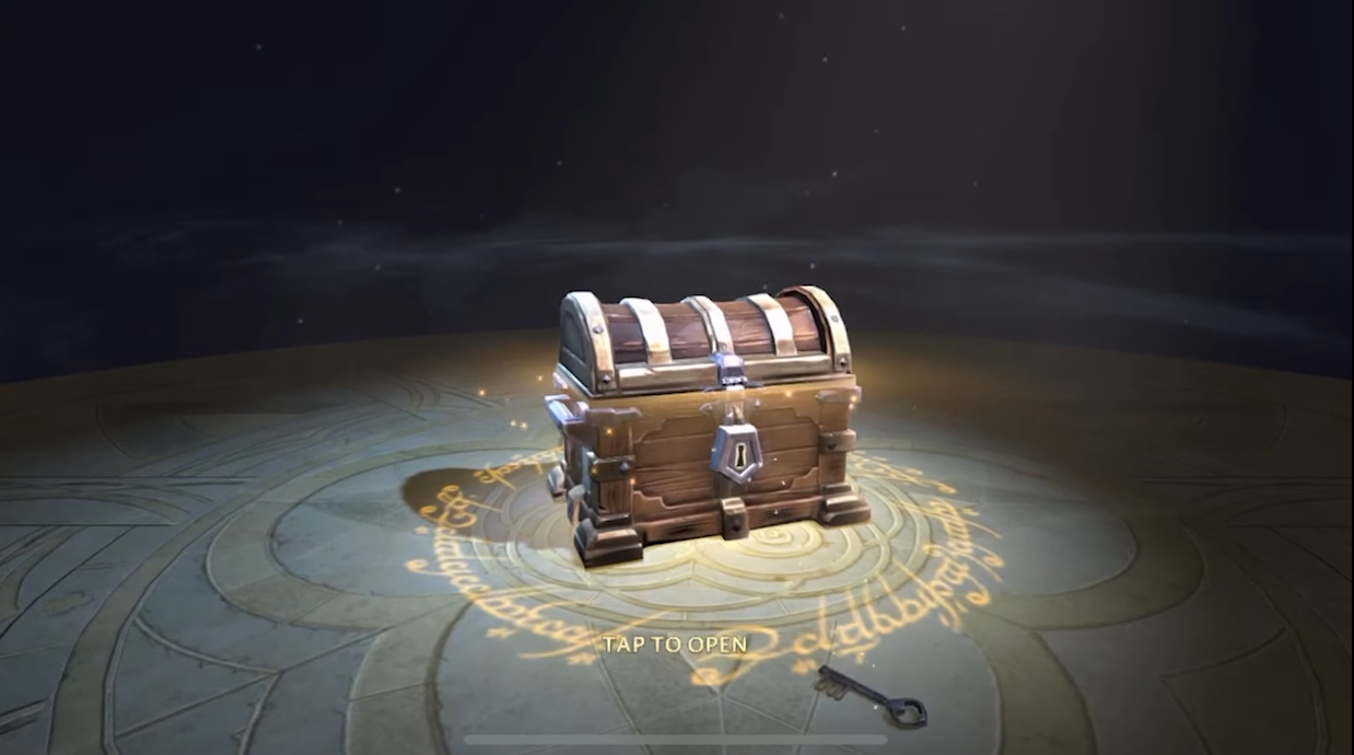 A lootbox in the style of a chest with glowing contents via The Lord of the Rings: Heroes of Middle-earth (2023), EA