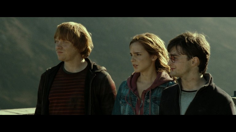 Ron Weasley (Rubert Gint), Hermoine Granger (Emma Watson), and Harry Potter (Daniel Radcliffe) look out to the future in the final scene of Harry Potter and the Deathly Hallows - Part 2 (2010), Warner Bros. Pictures