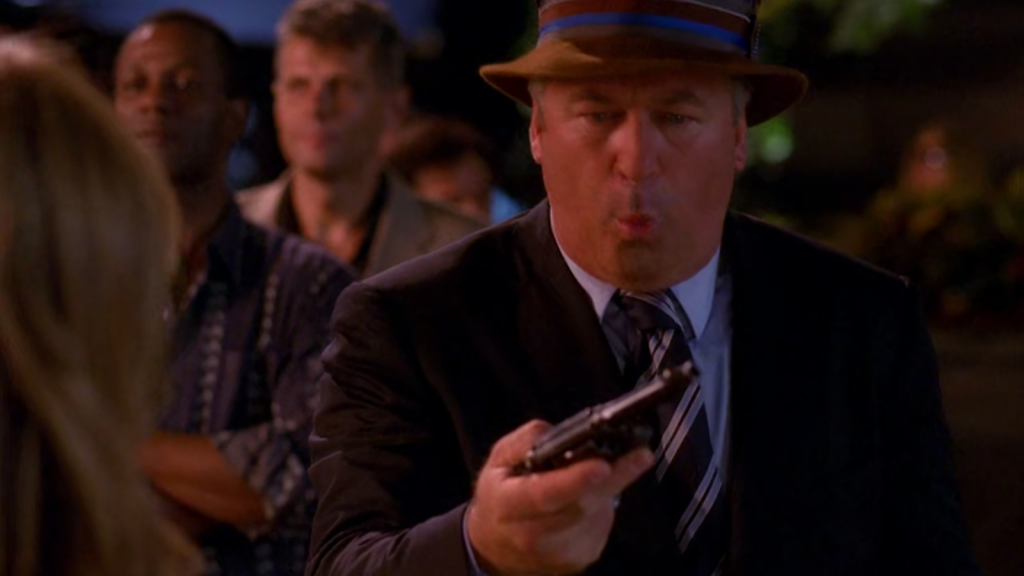 Jack Donaghy (Alec Baldwin) is surprised to find himself in possession of a gun in 30 Rock Season 3 Episode 3 The One with the Cast of Night Court (2008), NBC