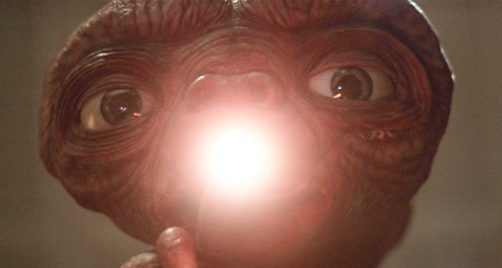 E.T. (Pat Welsh/Steven Spielberg/Kayden Green) opens up his heart in E.T. the Extra-Terrestrial (1982), Universal Pictures