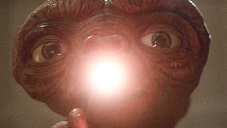 E.T. (Pat Welsh/Steven Spielberg/Kayden Green) opens up his heart in E.T. the Extra-Terrestrial (1982), Universal Pictures