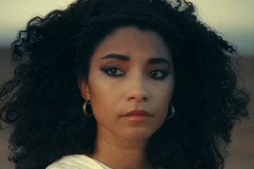 Cleopatra (Adele James) looks out upon the sands in Queen Cleopatra (2023), Netflix