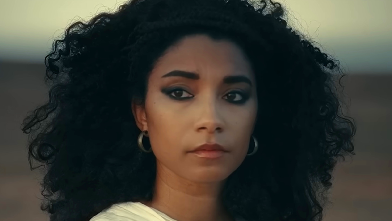 Cleopatra (Adele James) looks out upon the sands in Queen Cleopatra (2023), Netflix