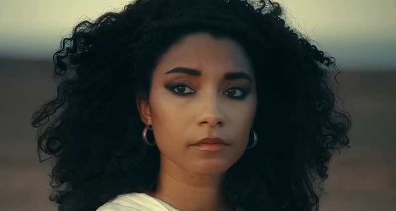 Cleopatra (Adele James) looks out upon the sands in Queen Cleopatra (2023), Netflix