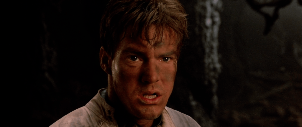 Willis 'Will' Davidge (Dennis Quaid) locates the crash-landed enemy ship in Enemy Mine (1985), 20th Century Fox