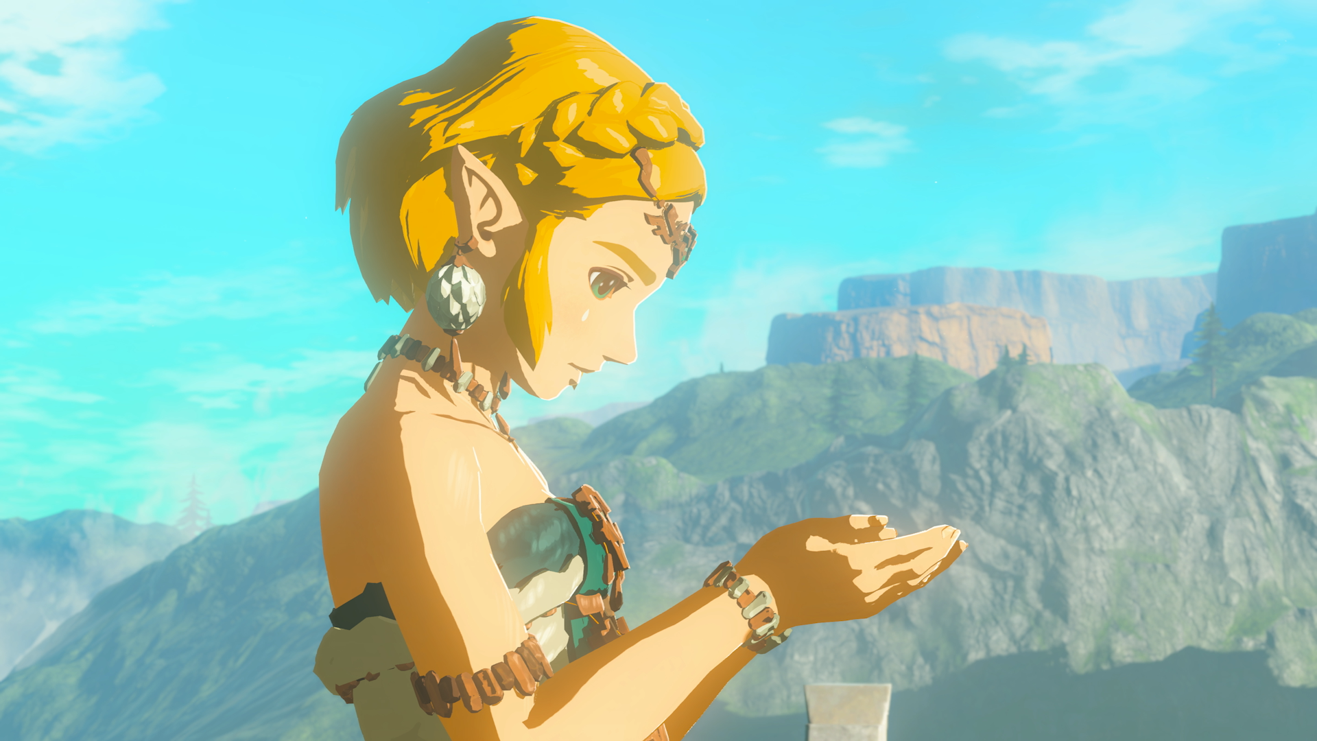 Zelda looks down at the mysterious gem in her hands in The Legend of Zelda: Tears of the Kingdom (2023), Nintendo