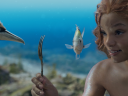 (L-R): Scuttle (voiced by Awkwafina), Flounder (voiced by Jacob Tremblay), and Halle Bailey as Ariel in Disney's live-action THE LITTLE MERMAID. Photo courtesy of Disney. © 2023 Disney Enterprises, Inc. All Rights Reserved.