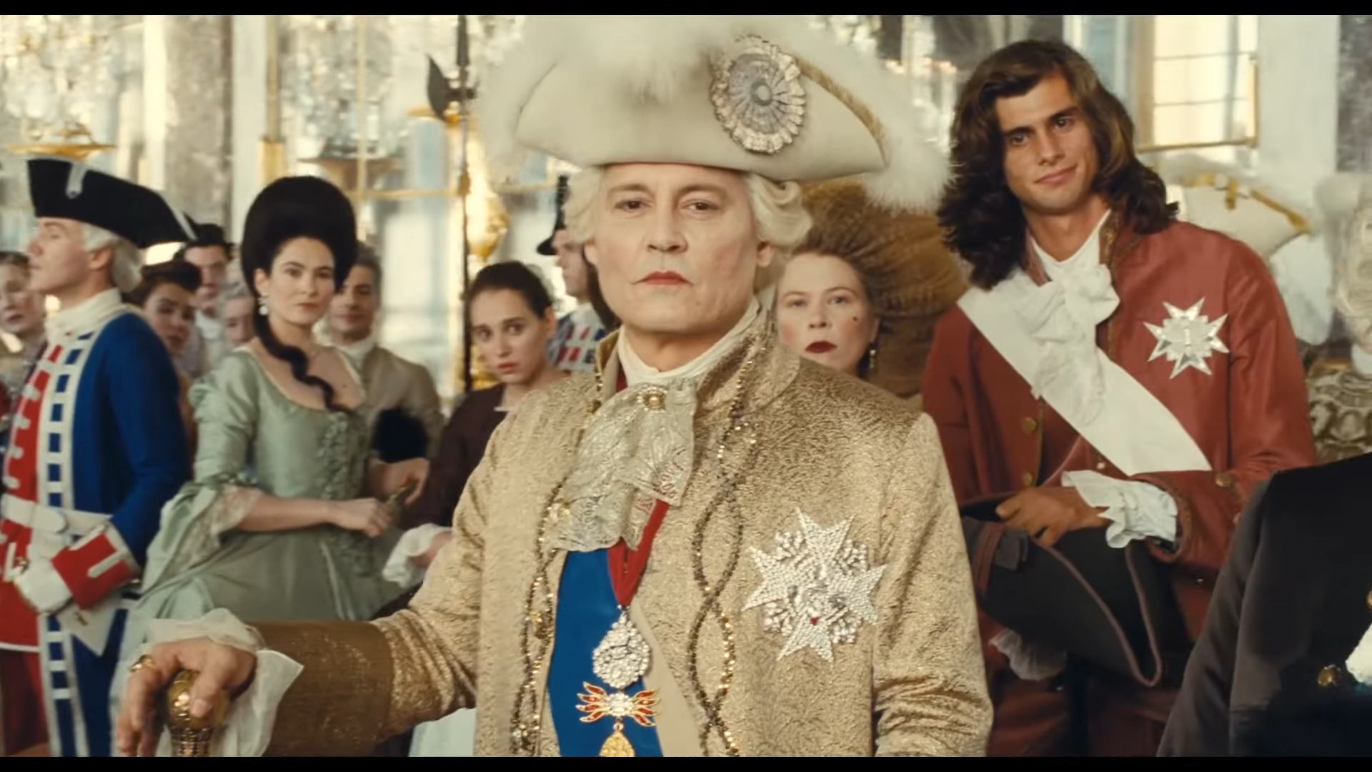 Louis XV (Johnny Depp) looks out upon hjs court in Jeanne du Barry (2023), La Pacte