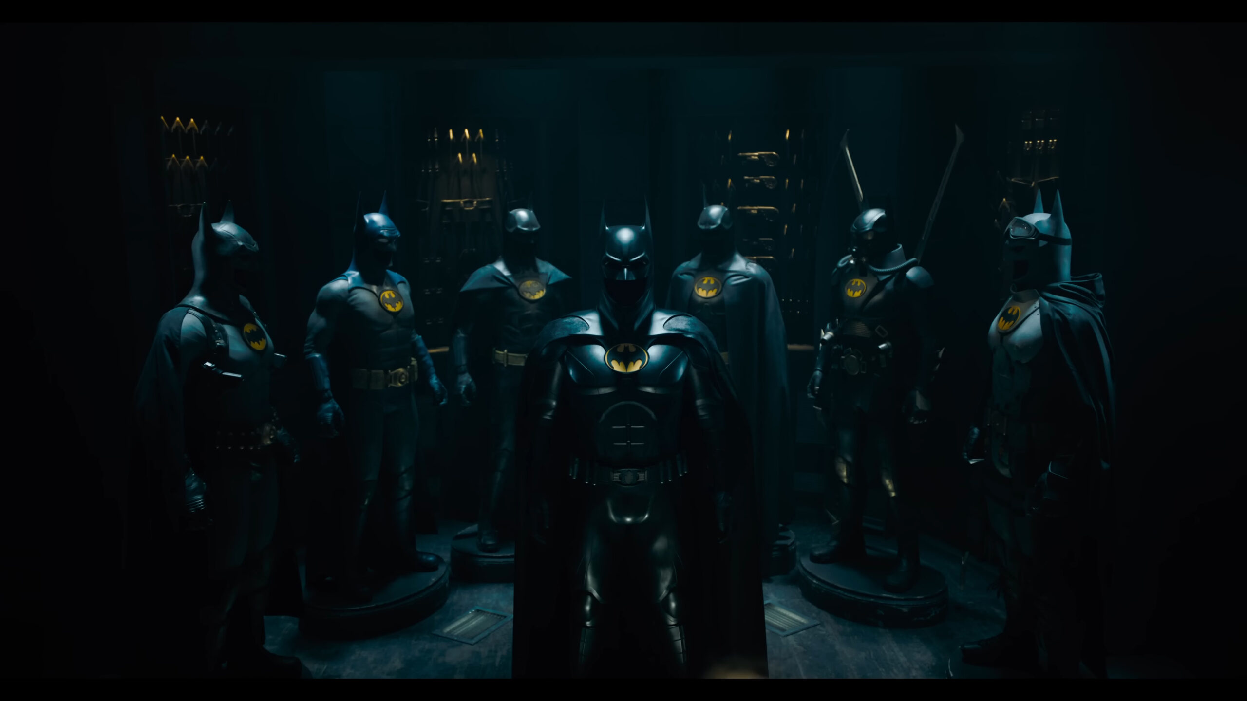 Batman (Michael Keaton) reveals his cache of Batsuits in The Flash (2023), Warner Bros. Pictures