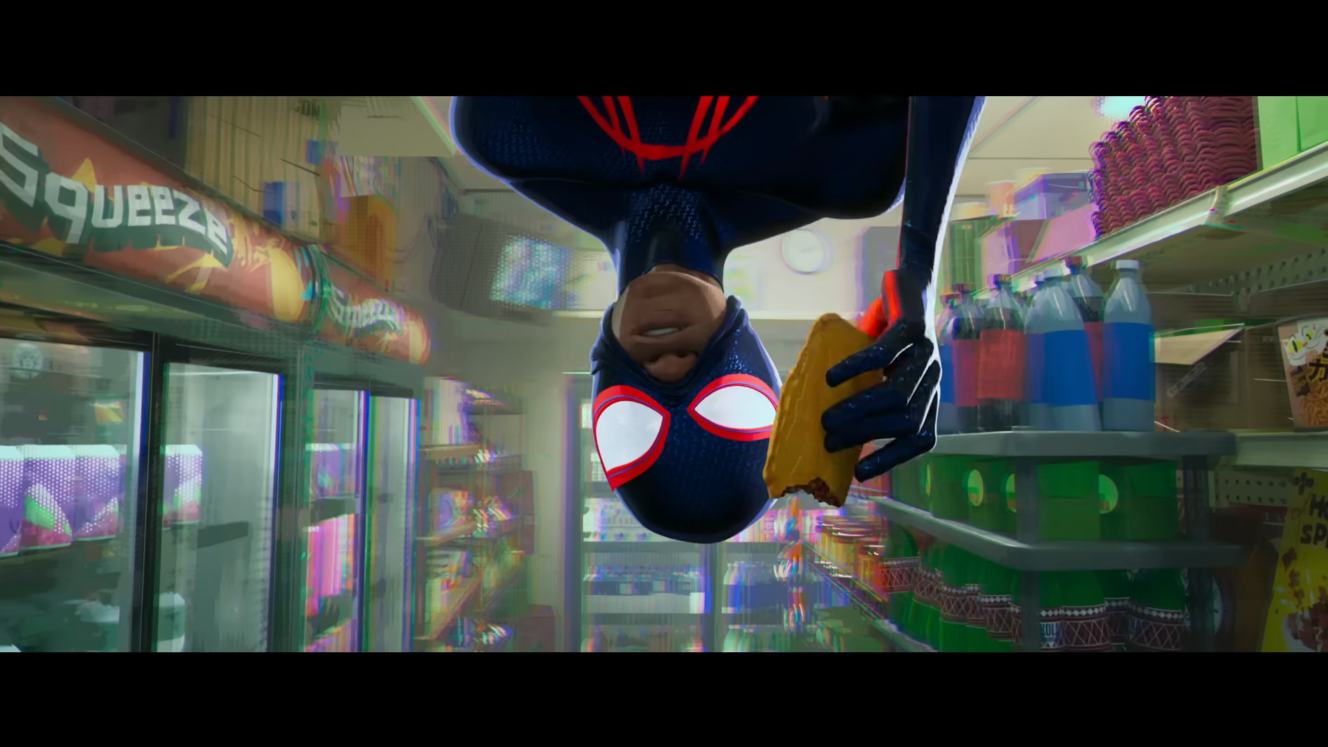 Miles Morales (Shamiek Moore) enjoys a snack while confronting The Spot (Jason Schwartzman) in Spider-Man: Across the Spider-Verse (2023), Sony Pictures