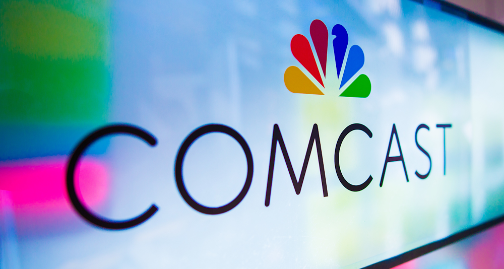 The company logo on a screen via Comcast