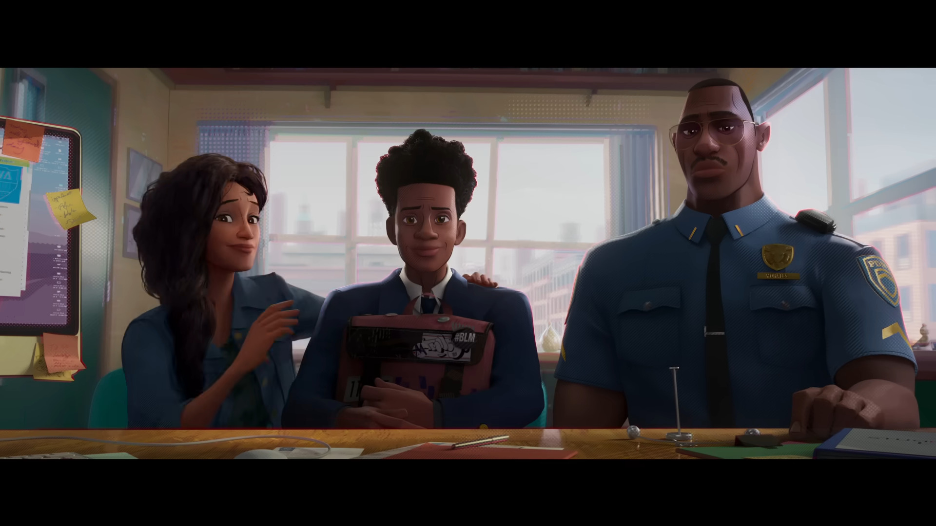 Miles Morales (Shamiek Moore) meets his parents Jefferson Davis (Brian Tyree Henry) and Rio Morales (Lauren Vélez) in Spider-Man: Across The Spider-Verse (2023), Sony Pictures