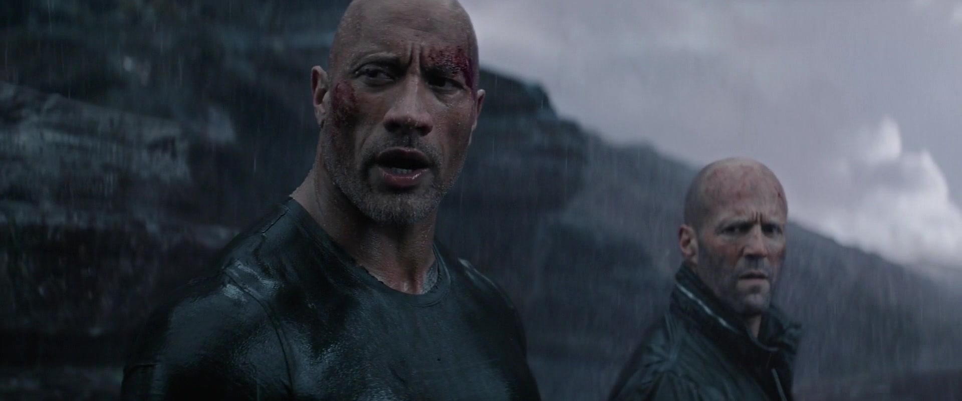 Lucas Hobbs (Dwayne 'The Rock' Johnson) and Deckard Shaw (Jason Statham) stand victorious in Fast & Furious Presents: Hobbs & Shaw (2019), Universal Pictures