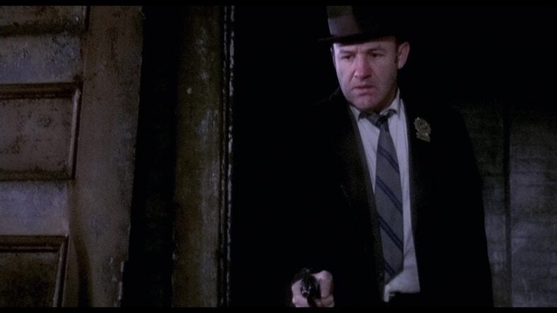 Jimmy "Popeye" Doyle (Gene Hackman) discovers he shot Agent Bill Mulderig (Bill Hickman) in The French Connection (1971), 20th Century Studios