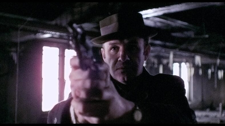 Jimmy "Popeye" Doyle (Gene Hackman) has Alain Charnier (Fernando Rey) in his sights in The French Connection (1971), 20th Century Studios