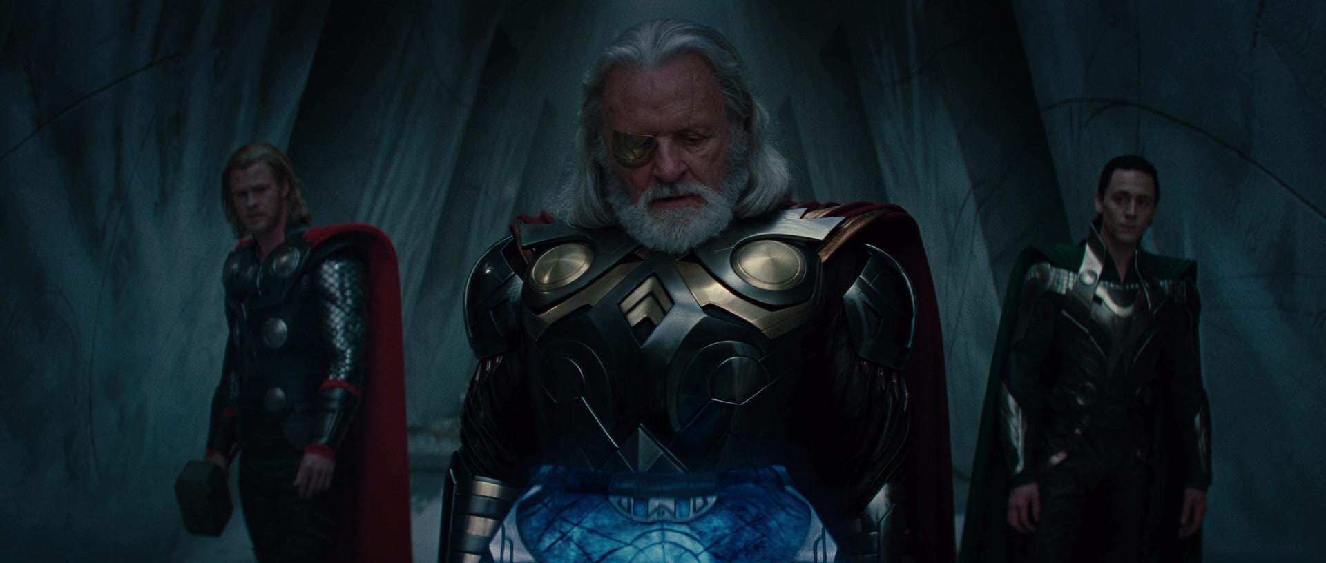 Odin (Anthony Hopkins) confers with his sons over the Casket of Winter in Thor (2011), marvel Entertainment