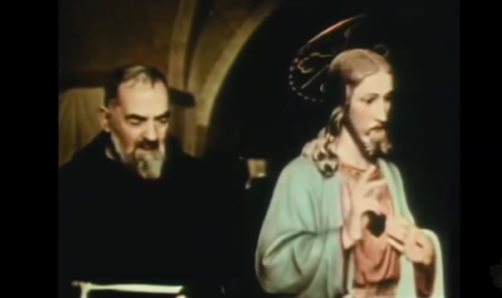 Padre Pio with statue of Christ