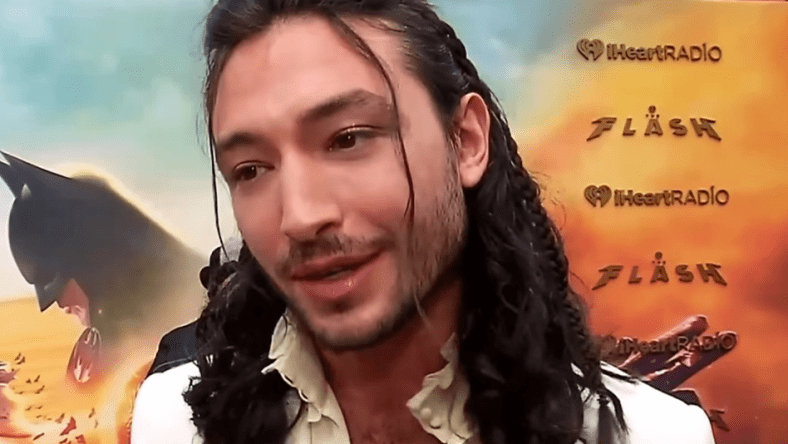 Ezra Miller speaks to TheMovieReport.com on The Flash's red carpet