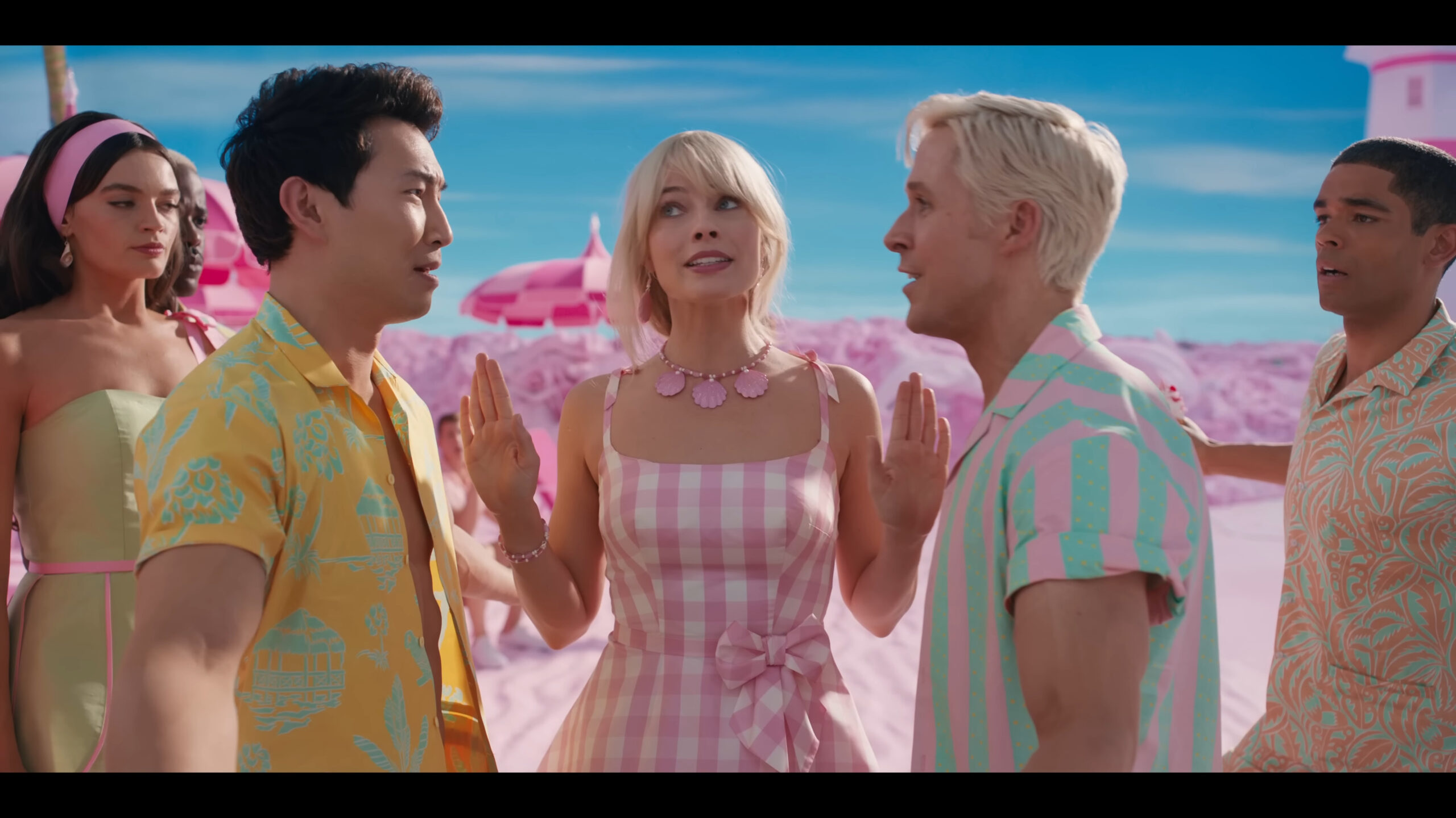 Barbie (Margot Robbie) attempts to break up Ken 2 (Simu Liu) and Ken (Ryan Gosling) in Barbie (2023), Warner Bros. Pictures