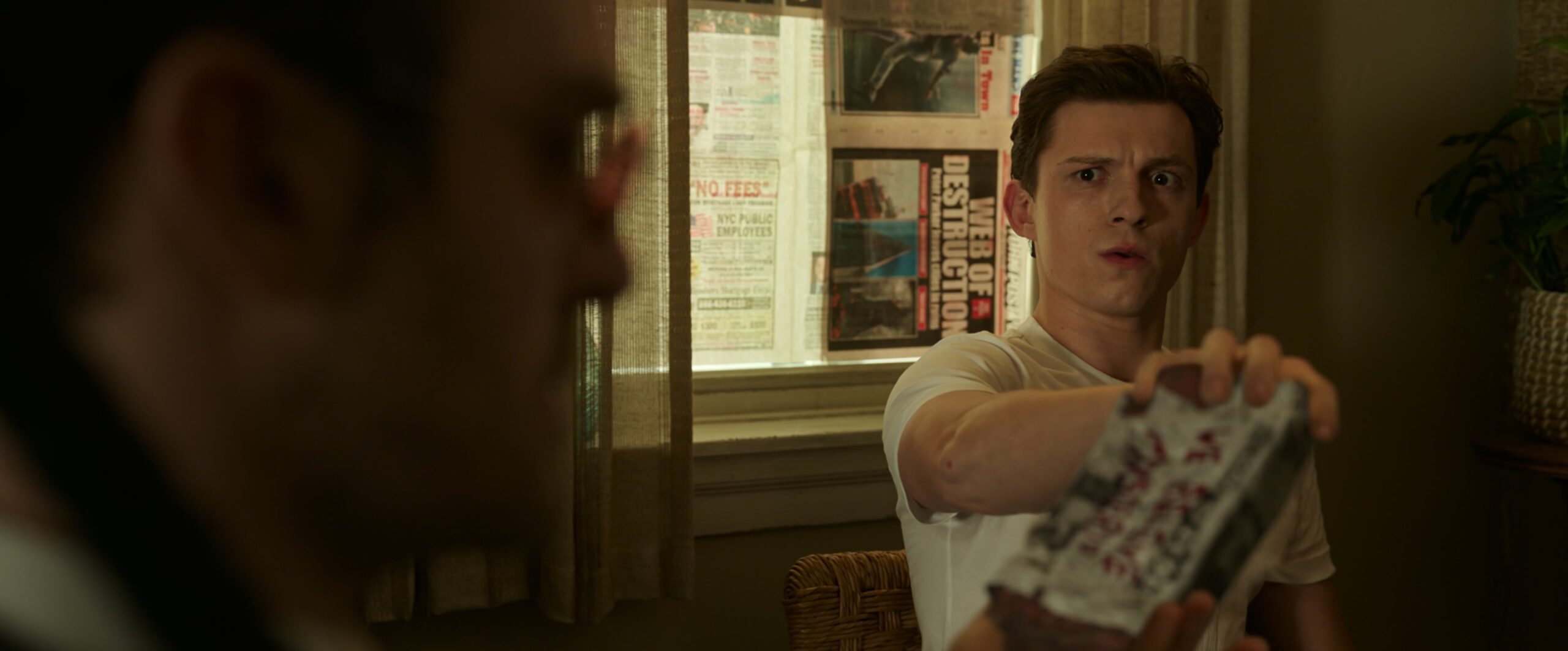 Peter Parker (Tom Holland) is taken aback by his lawyer's reflexes in Spider-Man: No Way Home (2021), Marvel Entertainment