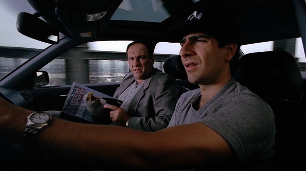 Christopher Moltisanti (Michael Imperioli) and Anthony Soprano (James Gandolfini) argue on the way to town in The Sopranos Season 1 Episode 1 "Pilot" (1999), HBO Entertainment