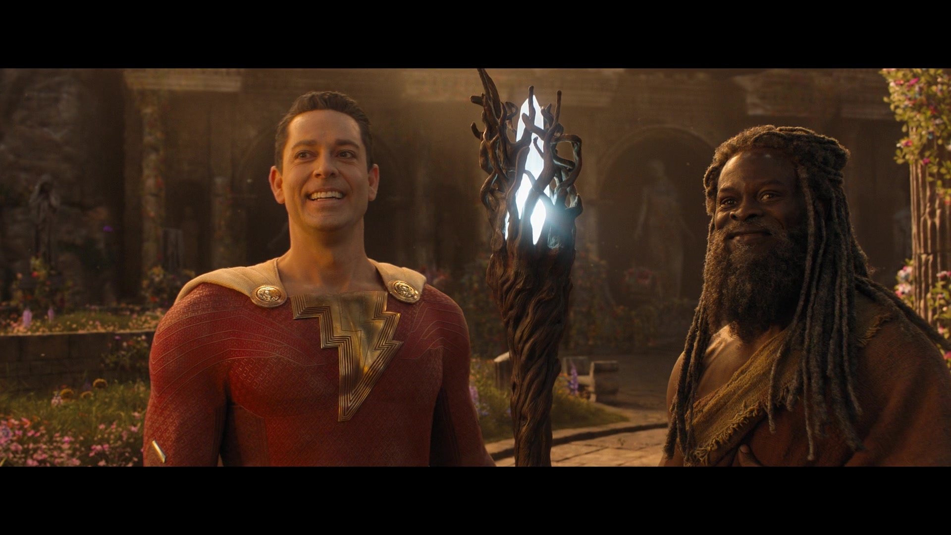 Shazam (Zachary Levi) and The Wizard (Djimon Honshu) restore the latter’ a staff in Shazam! Fury of the Gods (2023), Warner Bros. Pictures