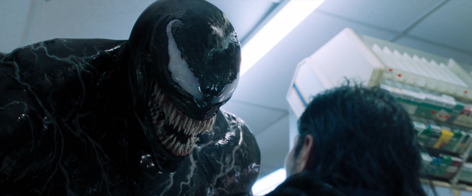 Venom (Tom Hardy) reveals himself to a thief in Venom (2018), Sony Pictures