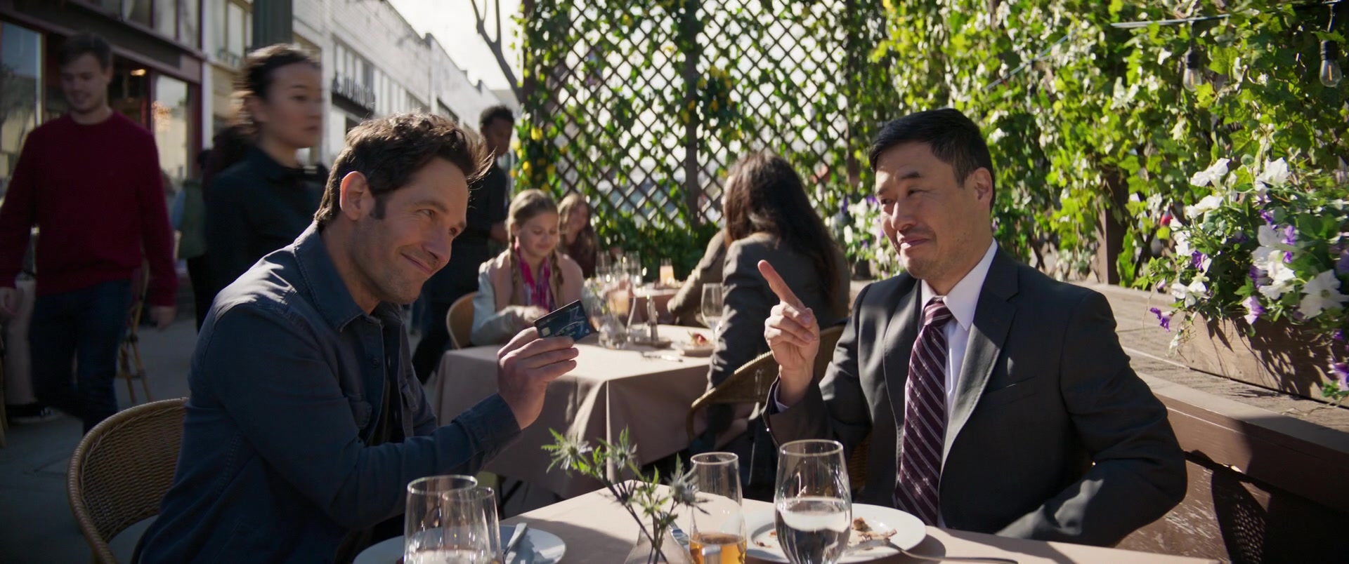 Scott Lang (Paul Rudd) and Jimmy Woo (Randall Park) grab lunch in Ant-Man and the Wasp: Quantumania (2023), Marvel Entertainment