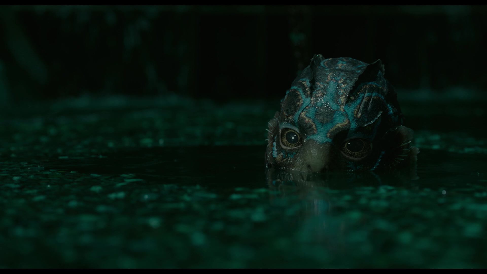 The Amphibian Man (Doug Jones) comes up for a snack in The Shape of Water (2017), Fox Searchlight