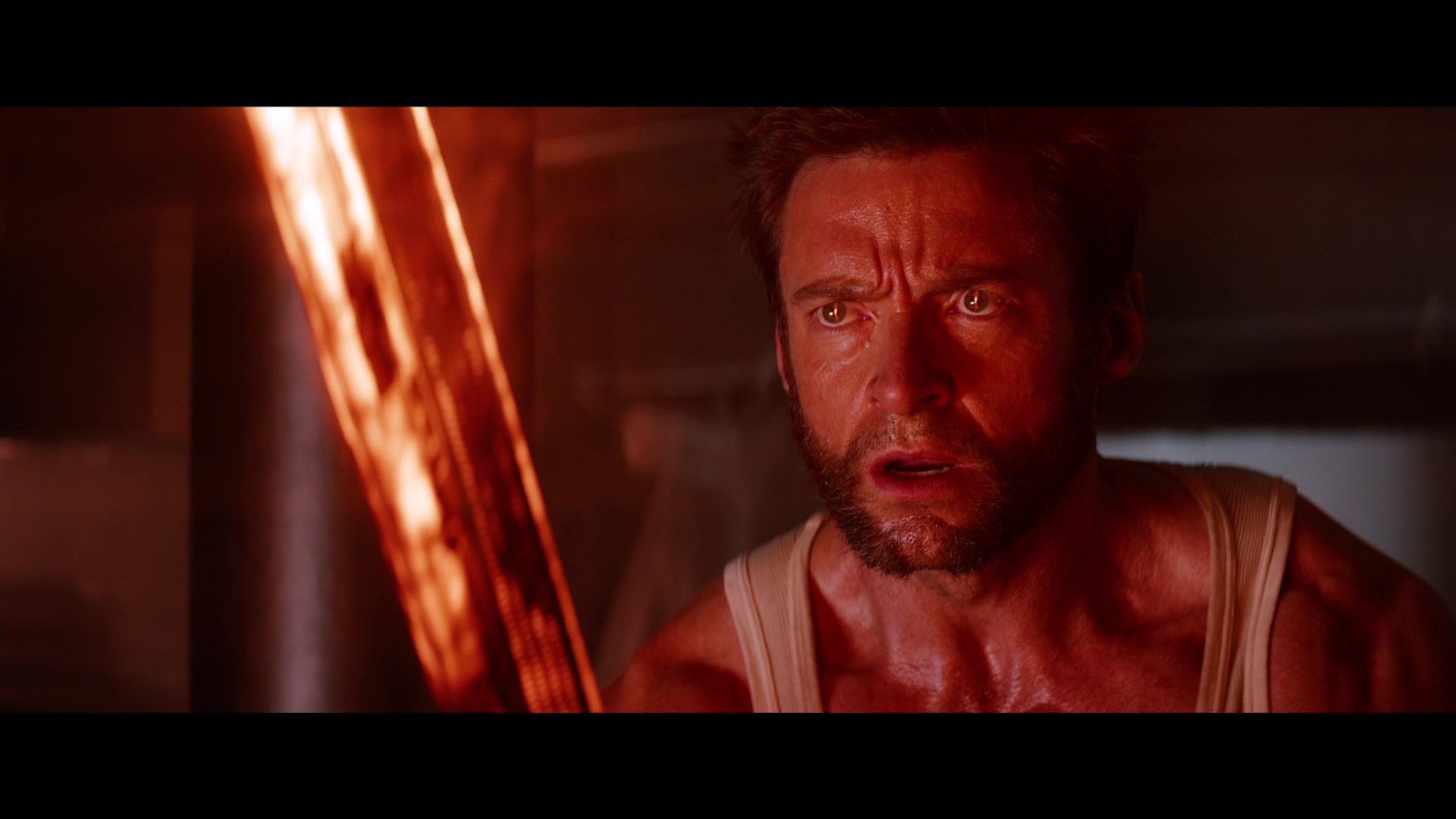 Wolverine (Hugh Jackman) stares down the blade of the Silver Samurai (Hal Yamanouchi) in The Wolverine (2014), Marvel Entertainment