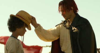 One Piece. (L to R) Colton Osorio as Young Luffy, Peter Gadiot as Shanks in season 1 of One Piece. Cr. Courtesy of Netflix © 2023