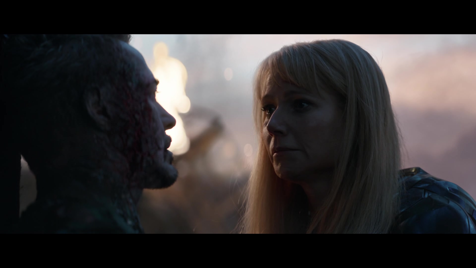 Pepper Potts (Gwenyth Paltrow) rushes to Tony Stark's (Robert Downey Jr.) side after he saves the universe in Avengers: Endgame (2019), Marvel Entertainment