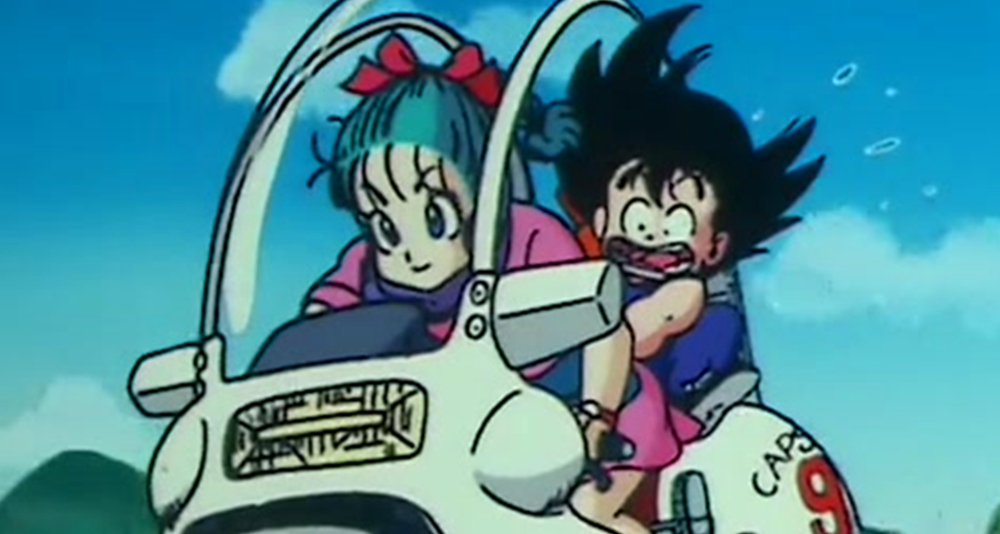Bulma (Hiromi Tsuru) takes a young Goku (Masako Nozawa) for his first motorcycle ride in Dragon Ball Episode 1 "Bulma and Son Goku" (1986), Toei Co. Ltd.