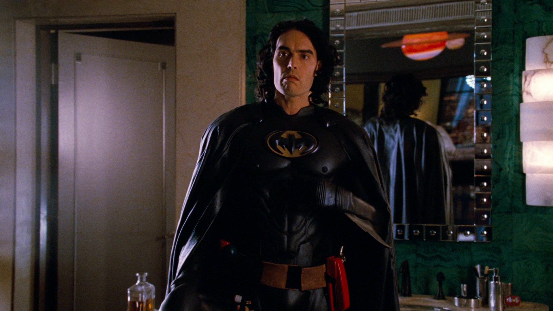 Arthur (Russell Brand) dons his recreation 1989 Batsuit in Arthur (2011), Warner Bros. Pictures
