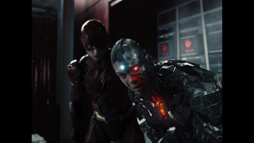 The Flash (Ezra Miller) checks in on Cyborg (Ray Fisher) after the latter experiences feedback from a Motherbox in Zack Snyder's Justice League (2021), Warner Bros. Pictures
