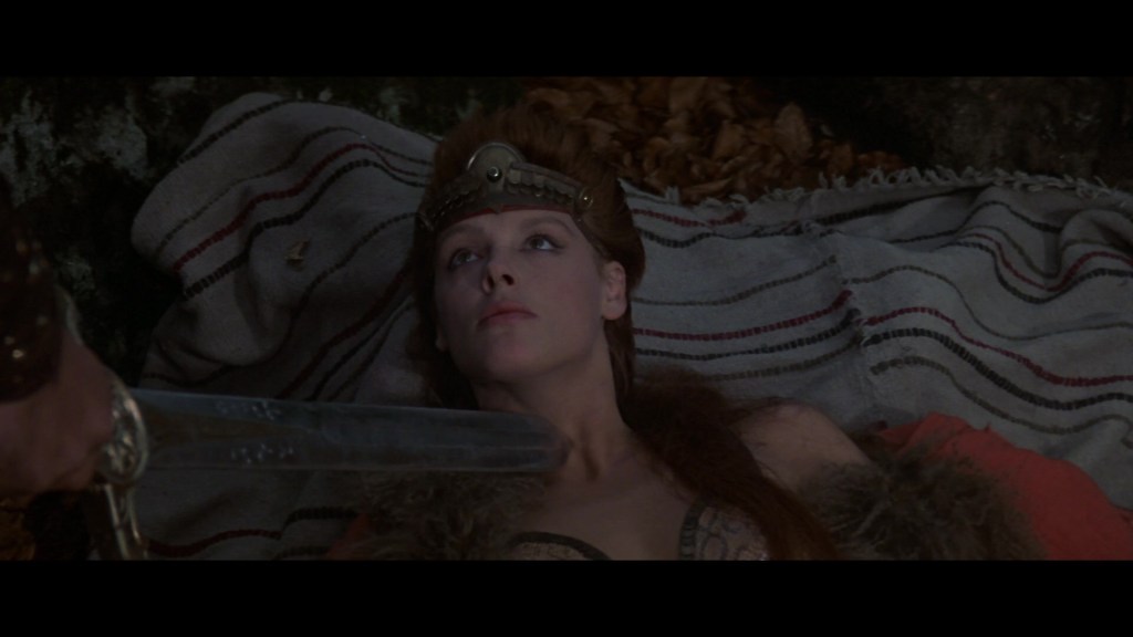 Red Sonja (Brigitte Nielsen) is challenged to a duel by Lord Kalidor (Arnold Schwarzenegger) in Red Sonja (1985), MGM