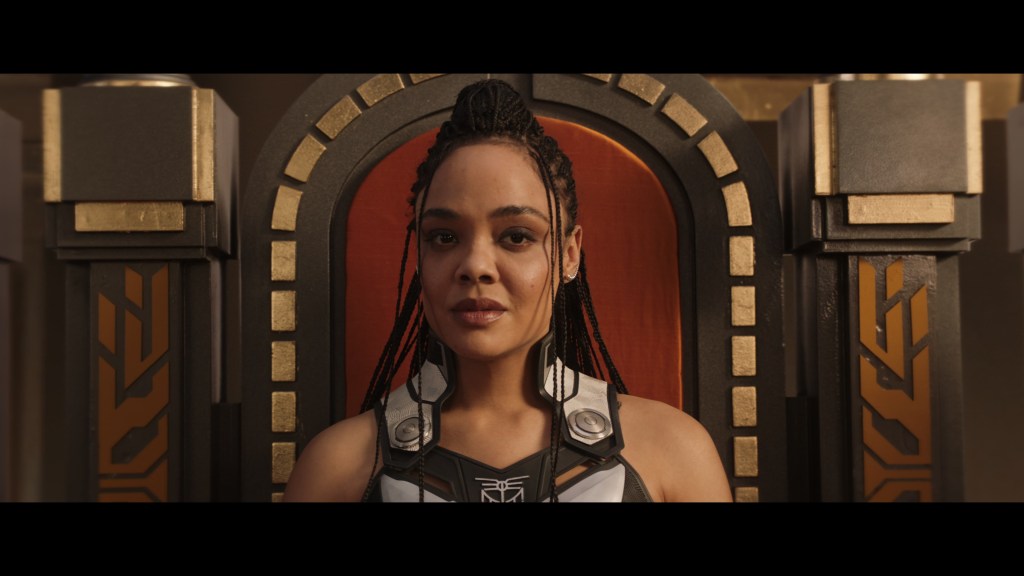 Valkyrie (Tessa Thompson) sits among the gods of Omnipotence City in Thor: Love and Thunder (2022), Marvel Entertainment