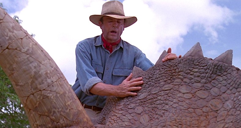 Dr. Alan Grant (Sam Neil) feels the skin of a dinosaur for the first time in Jurassic Park (1993), Universal Pictures