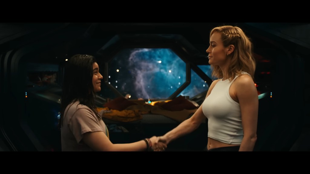 Ms. Marvel (Iman Vellani) formally introduces herself to her hero Captain Marvel (Carol Danvers) in The Marvels (2023), Marvel Entertainment