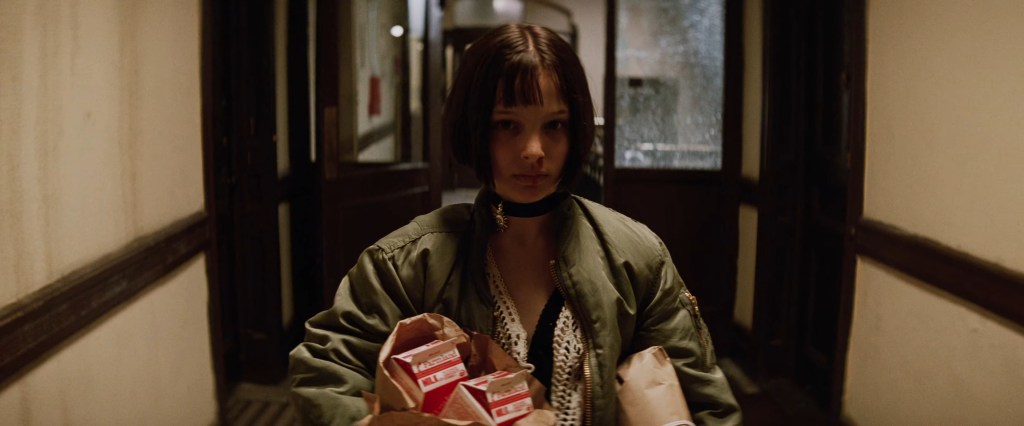 Mathilda (Natalie Portman) appraoches her neighbor Léon (Jean Reno) for help in Léon: The Professional (1994), Gaumont